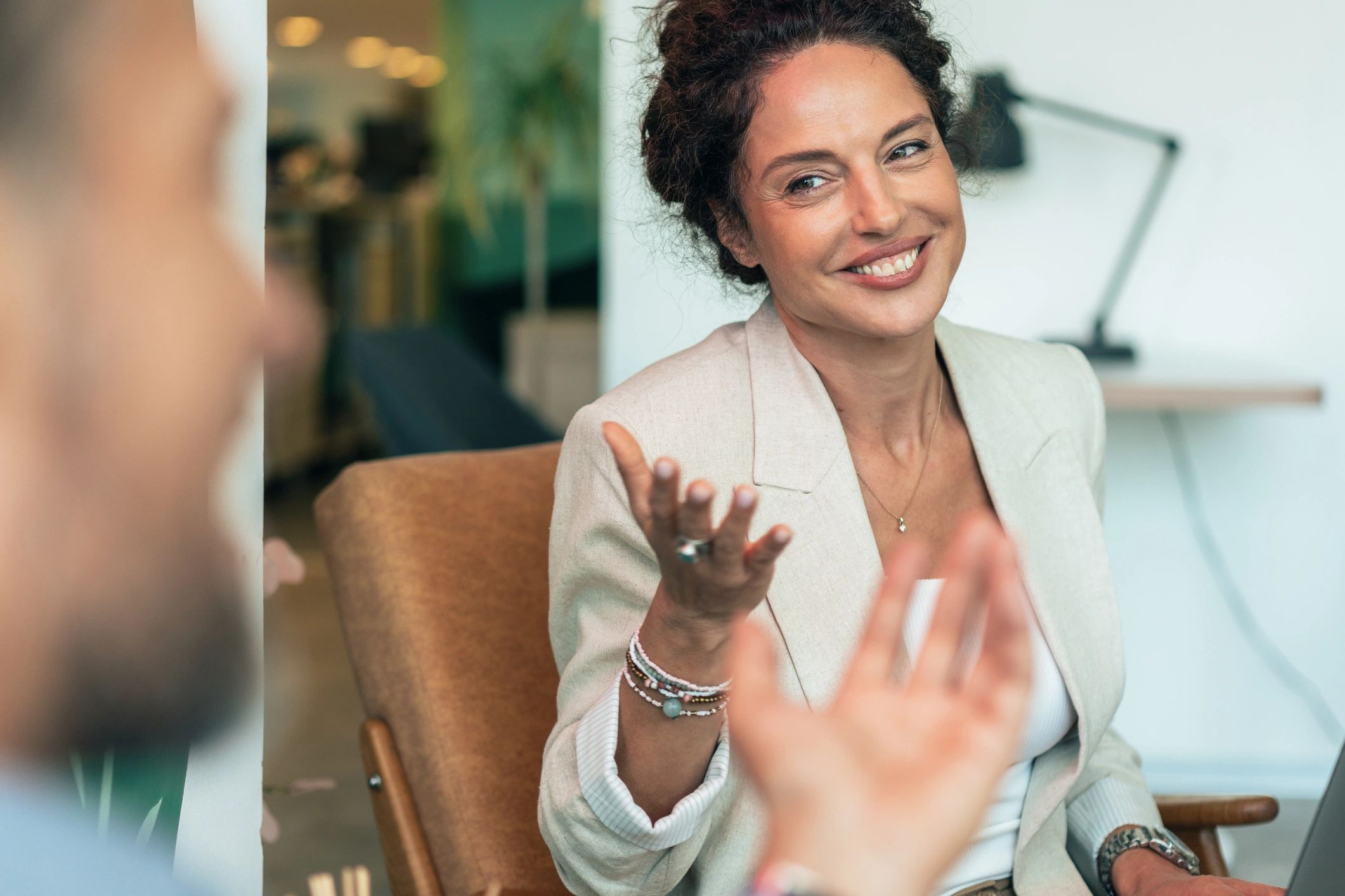 Professional coaching conversation in a calm office setting